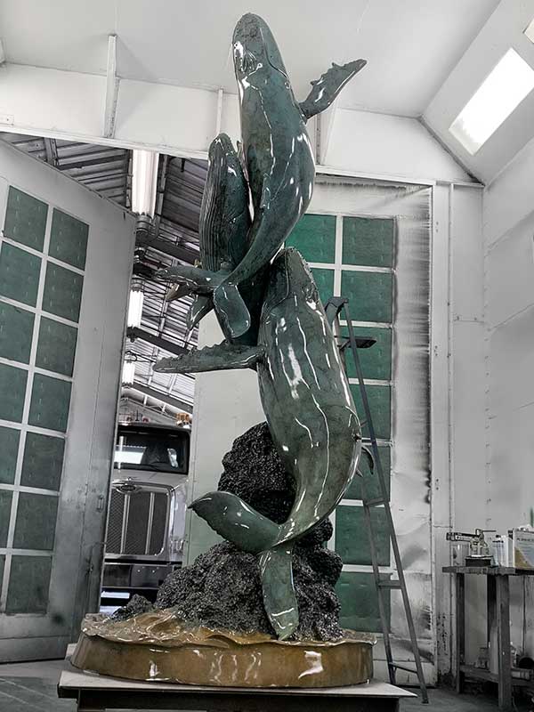 Patinating 13 foot Bronze Cast Whales at the American Fine Arts Foundry